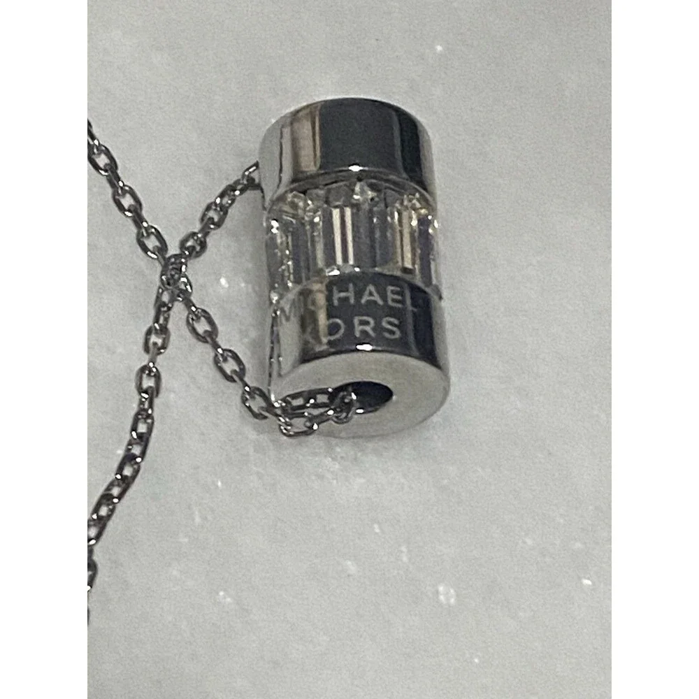 MICHAEL KORS SILVER TONE CRYSTAL BAGUETTE BARREL PENDANT NECKLACE-MKJ4950